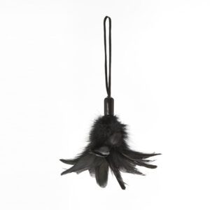 Black feather keychain with a loop strap against a white background.