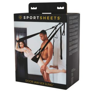 Couple using a black harness swing for intimate bedroom activities.