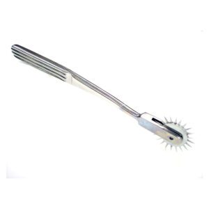 A metal fork with a unique spiked wheel at the end.