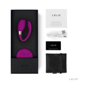 Purple personal massager set with accessories in black box.