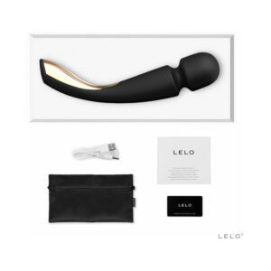 A sleek black personal massager with accessories and packaging.