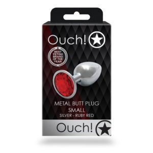 Small metal butt plug with a red jewel base in packaging.