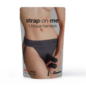 Packaging for a strap-on harness product.