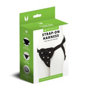 Box packaging of a black strap-on harness with adjustable straps.